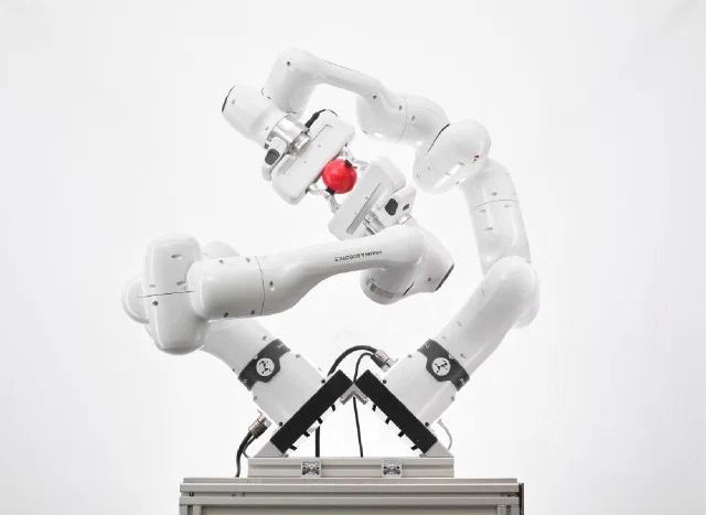 Two Franka Research 3 arms demonstrating dexterous manipulation in manufacturer imagery.