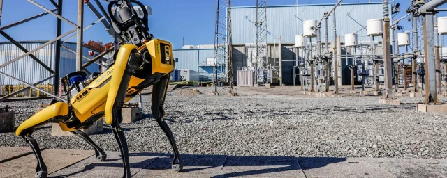 Boston Dynamics Spot carrying an inspection payload at an electrical utility.